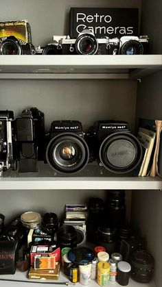 the shelves are filled with cameras and other things to take pictures in their own home