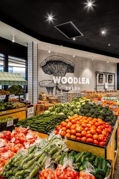 the produce section of a grocery store filled with fresh fruits and vegetables