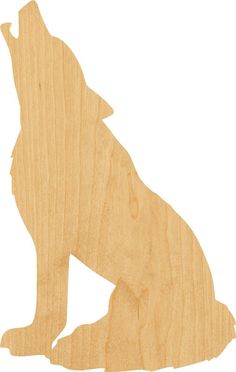 a wooden cutout of a wolf sitting down