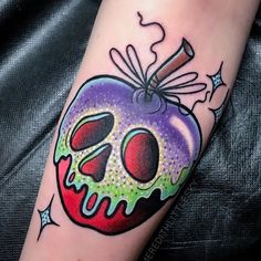 a colorful apple with a skull on it