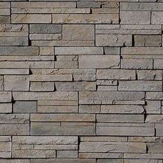 a stone wall that looks like it is made out of bricks