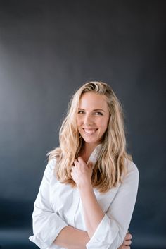 a woman posing for a photo with her arms crossed