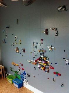 the wall is covered with legos and toys