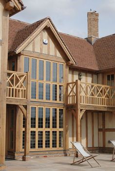 a large wooden house with lots of windows