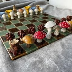 a close up of a chess board with mushrooms on it