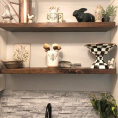 some shelves with vases and other items on them