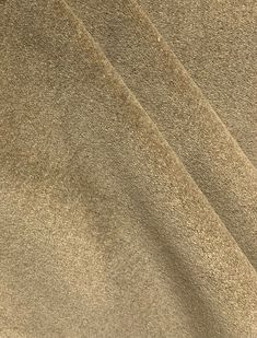 a close up view of a tan colored fabric