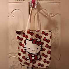 Fun And Super Cute Tote Bag. Sanrio / Cute Hello Kitty Tote Bag. This Bag Has Hello Kitty On The Front In A Red Dress With Her Red Hair Bows Throughout The Background. The Back Is Plain Canvas. Brand New With Tags. Great Condition. Super Cute Tote Bag To Use As A Purse, School Bag, Groceries, Etc. Size: 15 X 17 Inches Great Roomy Canvas Tote. Free Hello Kitty Play Pack With Bag. Toddler Tote Bag, Tote Bags Diy, Hello Kitty Tote Bag, Hello Kitty Tote, Kitty Play, Sanrio Bags, Kitty Ideas, Sanrio Bag, Red Hair Bow