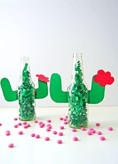 three bottles filled with confetti next to each other