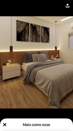 a bed room with a neatly made bed and two pictures on the wall above it