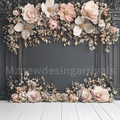 an empty room with flowers on the wall and wooden floor in front of black paneling