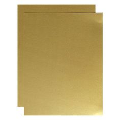 two sheets of gold colored paper on a white background