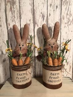 two small baskets with carrots and bunnies in them