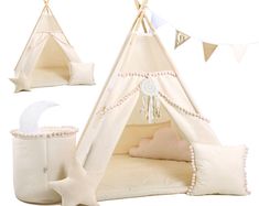 a teepee tent with pillows and decorations around it