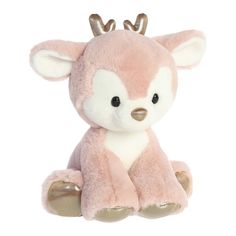 a pink and white stuffed animal with antlers on it's head sitting in front of a white background