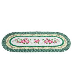 a green and white rug with pink flowers on the border, in front of a white background