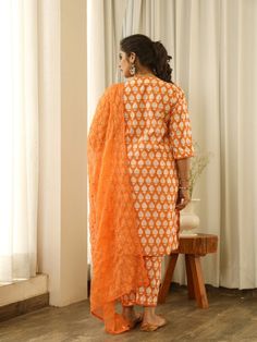 Beautiful handcrafted straight kurta pants set in pure cotton with lovely matching cotton doriya dupatta that is rightly finished with mirror embroidery. Color: Orange Fabric: Cotton and Kota Doria Note: Length and sizes can be customised Length - Kurta 40 inches Pants 38 inches Available in other colors If you happen to see some deformity in hand-work or fabric, that’s mere the technique of the same and not a defect. The garment is quite premium. The product will be delivered within 20-25 days Festive Mulmul Palazzo Set With Mirror Work, Festive Mirror Work Mulmul Palazzo Set, Diwali Cotton Silk Palazzo Set With Chikankari Embroidery, Orange Chikankari Embroidery Palazzo Set For Diwali, Designer Orange Sets With Chikankari Embroidery, Diwali Orange Chikankari Embroidery Palazzo Set, Orange Embroidered Palazzo Set With Straight Kurta, Straight Kurta In Cotton Silk With Mirror Work, Straight Cotton Silk Kurta With Mirror Work