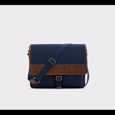 A Versatile Commuter-Friendly Messenger Bag. Perfect For Stowing Away Your Laptop, Paperwork And Anything You Need To Access During The Day. With An Adjustable Strap, This One Works For You. Strap Drop Length: 21'' Height: 12'' Width: 15'' Messenger Bag Magnetic Snap Closure Decorative Buckle Interior Compartment Optional Shoulder Strap Materials: Main: Synthetic Everyday Blue Satchel Laptop Bag, Blue Laptop Bag With Adjustable Strap For Daily Use, Blue Shoulder Laptop Bag For School, Blue Shoulder Bag Style Briefcase For Travel, Navy Satchel With Detachable Strap, Everyday Blue Leather Flap Bag, Blue Satchel Bag For Business, Blue Pouch Bag For Business, Blue Everyday Laptop Satchel Bag