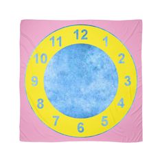 a blue and yellow clock with numbers on it's face in the middle of a pink background