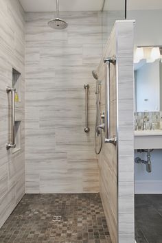 a walk in shower sitting next to a white sink