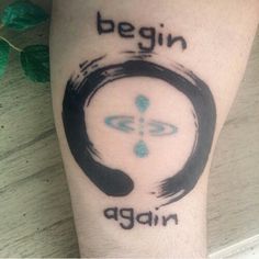 a tattoo with the words begin again on it