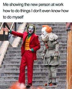 two clowns standing on some stairs with their arms out and one is pointing at the other