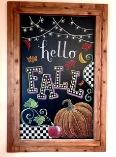 a chalkboard with the words hello fall painted on it