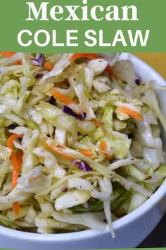 a white bowl filled with coleslaw and carrots on top of a table