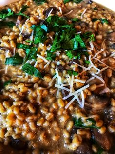 a bowl filled with lots of food and garnished in parmesan cheese