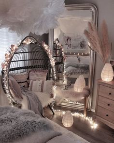 a bedroom decorated with lights and feathers