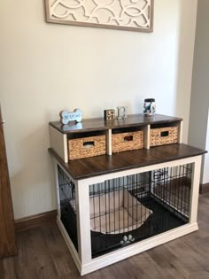 a dog house with two crates on top of it and a cat bed in the middle