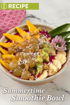 a bowl filled with fruit and nuts on top of a table