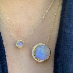 Be bold and unique with this stunning larger size moon phase necklace. Featuring a truly breathtaking 16mm diameter center stone, cut in-house from all-natural materials, and nestled into a custom-made gold setting with natural, conflict-free diamonds, this gorgeous necklace is sure to become the centerpiece of your jewelry collection. Rainbow moonstone, a feminine stone with relaxing energy, is a great choice for this bold contemporary style. We use all-natural stones in each and every piece we Moon Stone Necklace, Moonstone Jewellery, Fresh Starts, Moon Phases Necklace, Rainbow Moonstone Necklace, Wardrobe Wishlist, Colored Stones, Moonstone Necklace, Moonstone Jewelry