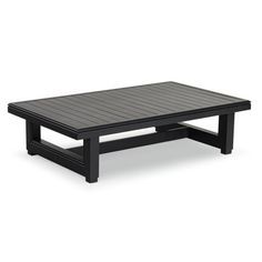 an outdoor coffee table with black wood slats