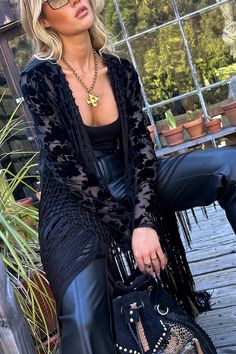 Fall means it’s kimono season - we don’t make the rules. Made from a black velvet burnout material with fringe cascading down the sleeves, the Stone Black Velvet Burnout Kimono is the boho chic finishing touch to all your fall time looks. Country Goth, Gothic Western, Fall Bottoms, Western Bachelorette, Concert Top, Party Bottoms, Concert Dresses, 12th Tribe, Denim And Diamonds