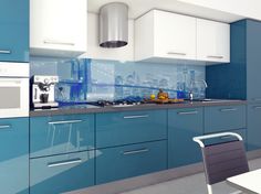 a kitchen with blue cabinets and white appliances