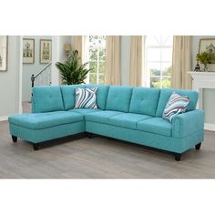 a blue sectional couch in a living room