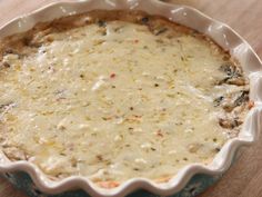 an uncooked pie sitting on top of a wooden table