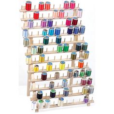 a rack that has many spools of thread on it