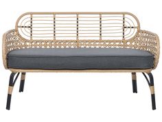 a wicker bench with grey cushions and black legs