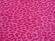 a pink and black animal print fabric