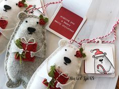 three christmas ornaments made to look like polar bears