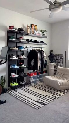 a living room filled with lots of furniture and shelves full of shoes on top of them