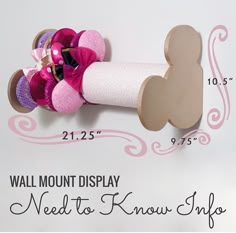 a wall mounted display next to know shop with pink and purple hair accessories on it