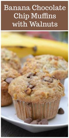 banana chocolate chip muffins with walnuts on a white plate next to bananas