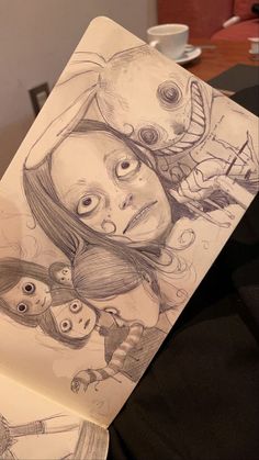 a drawing of two girls with faces on them