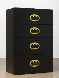 three black drawers with gold batman symbols on them