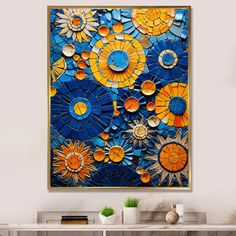 an abstract painting with sunflowers in blue, orange and yellow colors on the wall