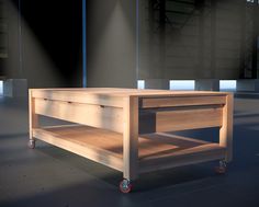 a wooden table sitting on top of a floor next to a building with glass windows