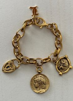 This Antique gold tone bracelet features four charms: 12k antique gold plated medallion, bee intaglio and padlock charms.  Your personalized initial charm(choose at the checkout) is 18k gold plated stainless steel. Chunky oval belcher antique gold plated stainless steel. Total length is 8.5 inches. Large lobster clasp can be hooked to any of the chain links. 🎁All orders are shipped in a box. Bracelet Chain, Chain Links, Jewelry Lookbook, Gold Bracelet Chain, Casual Chic Outfit, Initial Charm, Chic Outfit, Jewelry Gold, Cute Jewelry